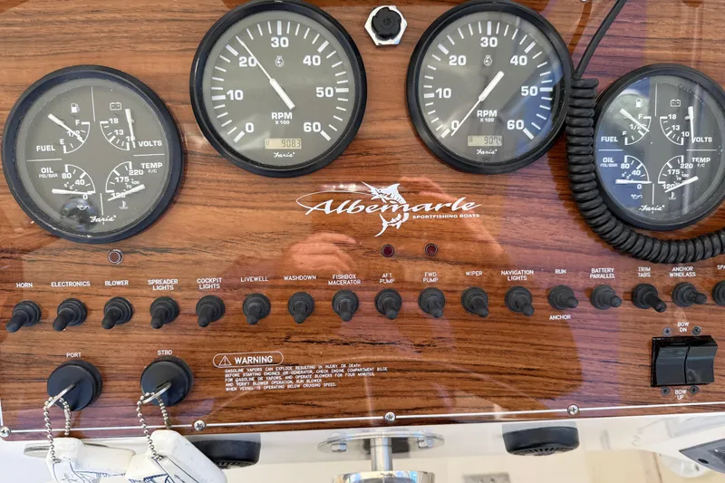 Slide: The Image of Dashboard of 2005 Albemarle 280 Express Fisherman with gauges and switches. - 26