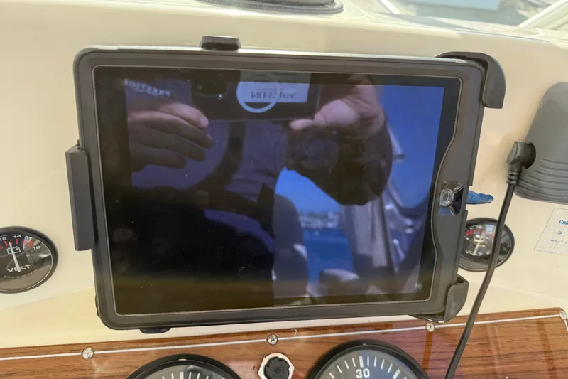 Slide: The Image of Dashboard of 2005 Albemarle 280 Express Fisherman with tablet and gauges. - 28