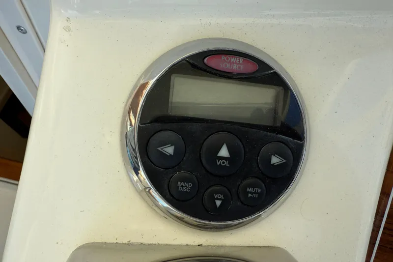 Slide: The Image of Control panel on 2005 Albemarle 280 Express Fisherman boat, featuring volume and power buttons. - 31