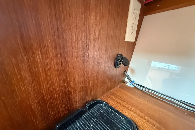 Slide: The Image of Interior of 2005 Albemarle 280 Express Fisherman with wood paneling and electrical outlet. - 41