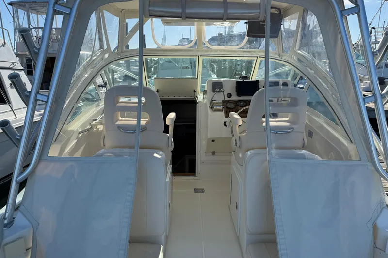 Slide: The Image of 2005 Albemarle 280 Express Fisherman boat interior with helm and seating. - 5