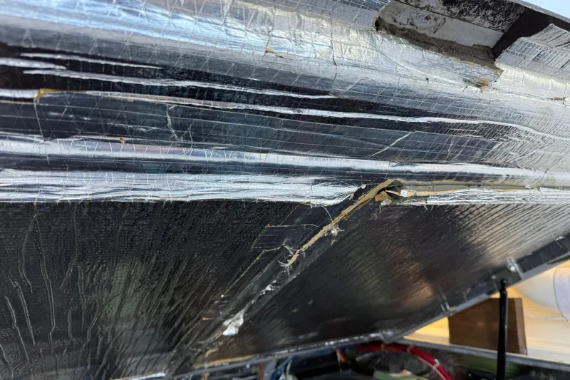 Slide: The Image of Close-up of 2005 Albemarle 280 Express Fisherman boat's interior insulation detail. - 57