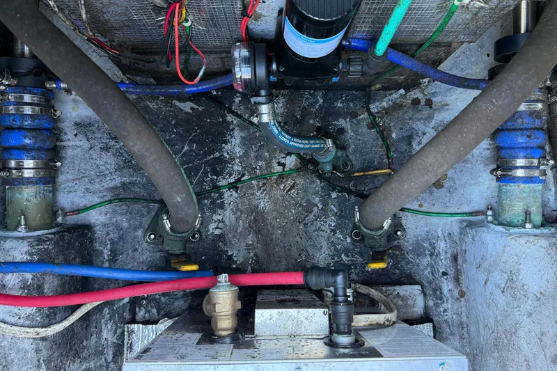 Slide: The Image of Engine compartment of a 2005 Albemarle 280 Express Fisherman with visible hoses and wiring. - 59