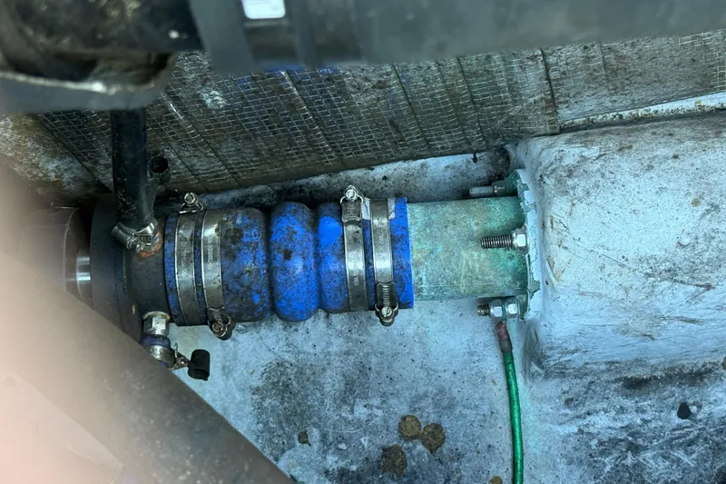 Slide: The Image of Close-up of 2005 Albemarle 280 Express Fisherman boat engine component with blue hose clamps. - 61