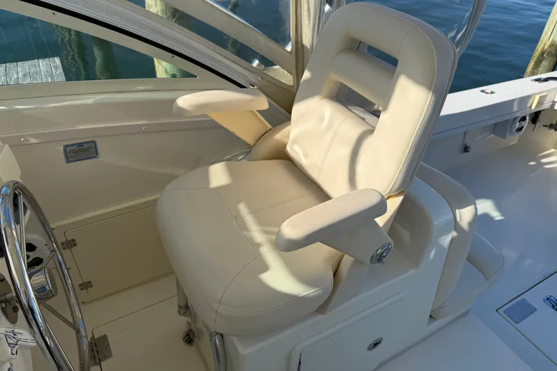 Slide: The Image of Captain's chair on 2005 Albemarle 280 Express Fisherman boat, featuring a sleek design. - 9