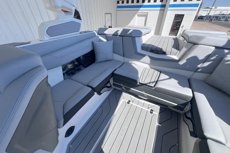 Slide: The Image of 2025 Nautique Super Air Nautique G21 interior with luxurious seating and modern design. - 10