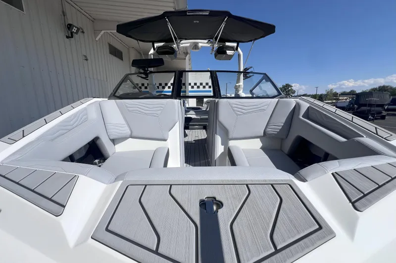 Slide: The Image of 2025 Nautique Super Air Nautique G21 boat interior with sleek seating and modern design. - 13