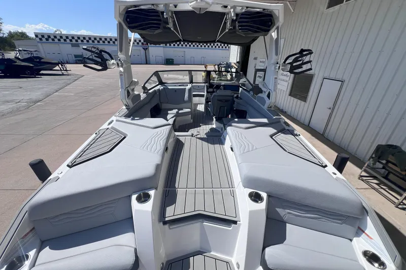 Slide: The Image of 2025 Nautique Super Air Nautique G21 boat interior with sleek seating and modern design. - 8