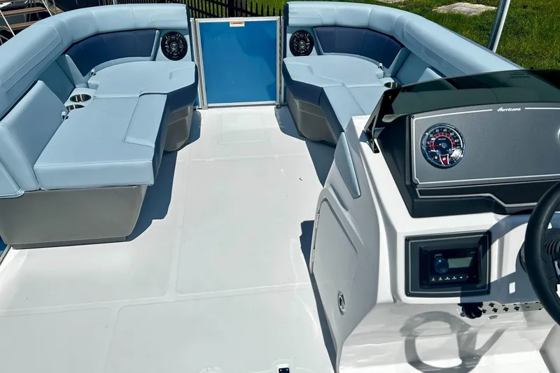 Slide: The Image of 2025 Hurricane FunDeck 2260 RE OB boat interior with spacious seating and modern dashboard. - 5
