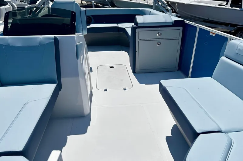 Slide: The Image of 2025 Hurricane FunDeck 2260 RE OB interior with spacious seating and storage. - 6