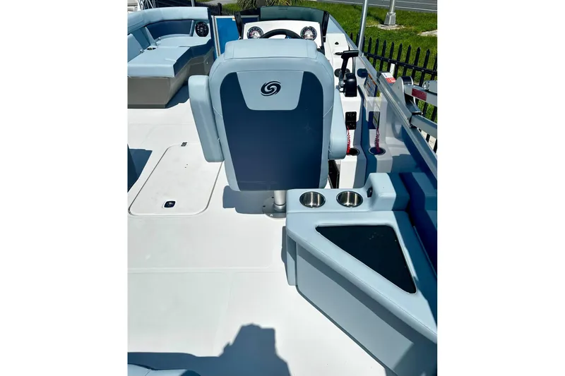 Slide: The Image of 2025 Hurricane FunDeck 2260 RE OB interior with helm, seating, and cup holders. - 7