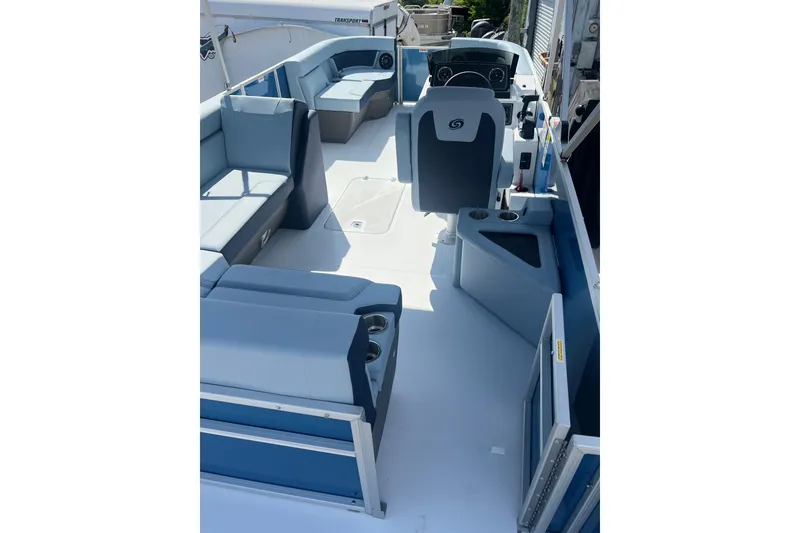 Slide: The Image of 2025 Hurricane FunDeck 2260 RE OB interior with spacious seating and modern design. - 8