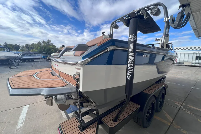 Slide: The Image of 2024 Nautique Super Air Nautique GS22 boat on trailer, showcasing sleek design and features. - 6