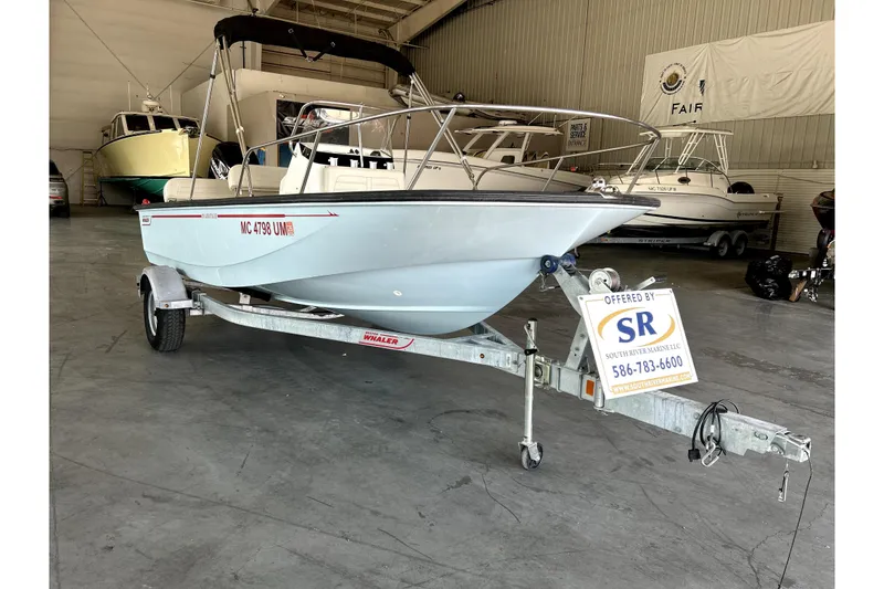 The Image of 2020 Boston Whaler 170 Montauk boat on trailer in indoor storage facility. - 0