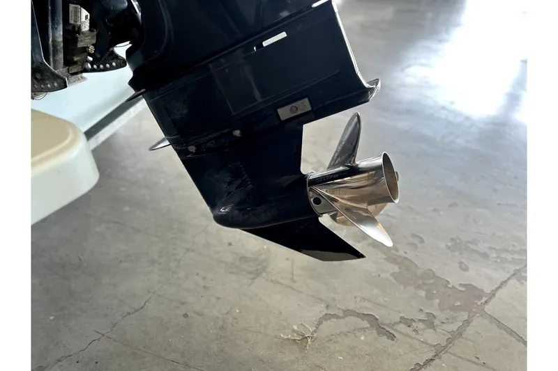 Slide: The Image of Close-up of a 2020 Boston Whaler 170 Montauk boat propeller on concrete floor. - 18