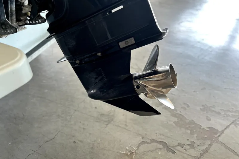 Slide: The Image of 2020 Boston Whaler 170 Montauk boat propeller close-up on concrete floor. - 21