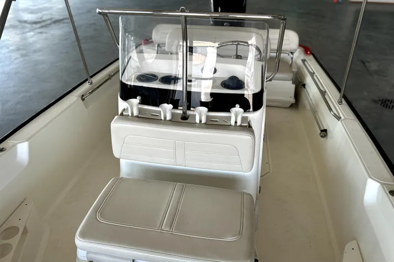 Slide: The Image of 2020 Boston Whaler 170 Montauk boat interior with seating and console. - 6