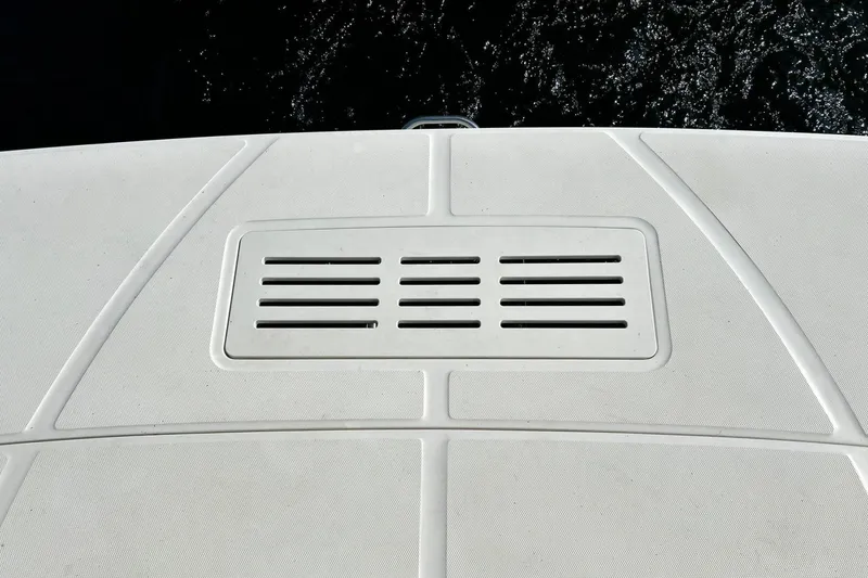 Slide: The Image of 2014 Sea Ray 350 Sundancer swim platform with vent, against dark water background. - 28