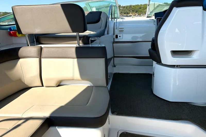 Slide: The Image of Interior view of 2014 Sea Ray 350 Sundancer boat with beige seating. - 33