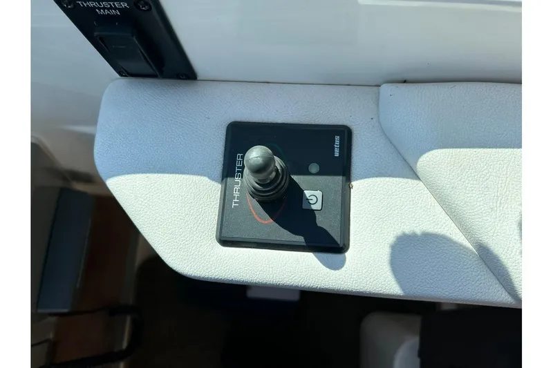 Slide: The Image of Control panel of 2014 Sea Ray 350 Sundancer boat with thruster joystick. - 50