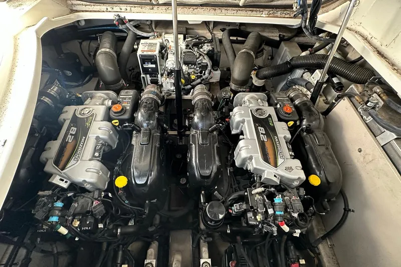 Slide: The Image of Engine compartment of a 2014 Sea Ray 350 Sundancer with twin MerCruiser engines. - 54