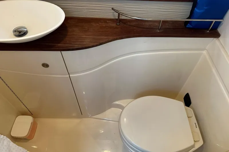 Slide: The Image of Bathroom interior of 2014 Sea Ray 350 Sundancer with sink and toilet. - 71