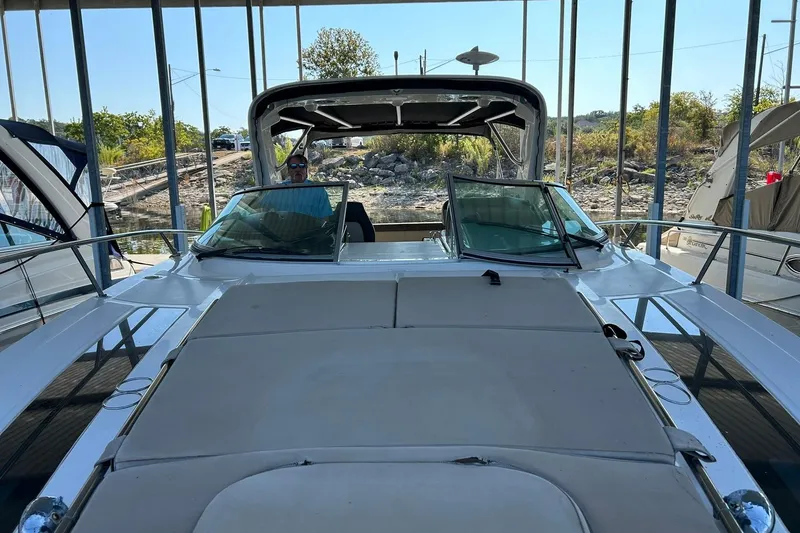 Slide: The Image of 2014 Sea Ray 350 Sundancer docked, featuring spacious deck and sleek design. - 72