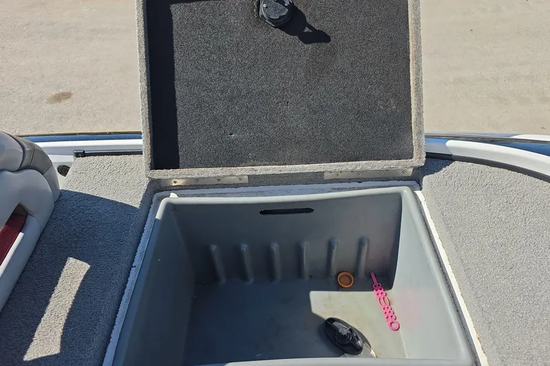 Slide: The Image of Open storage compartment on 2011 Nitro Z-8 boat with carpeted lid. - 12