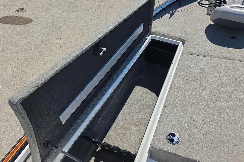 Slide: The Image of Open storage compartment on 2011 Nitro Z-8 boat deck, showing interior details. - 14