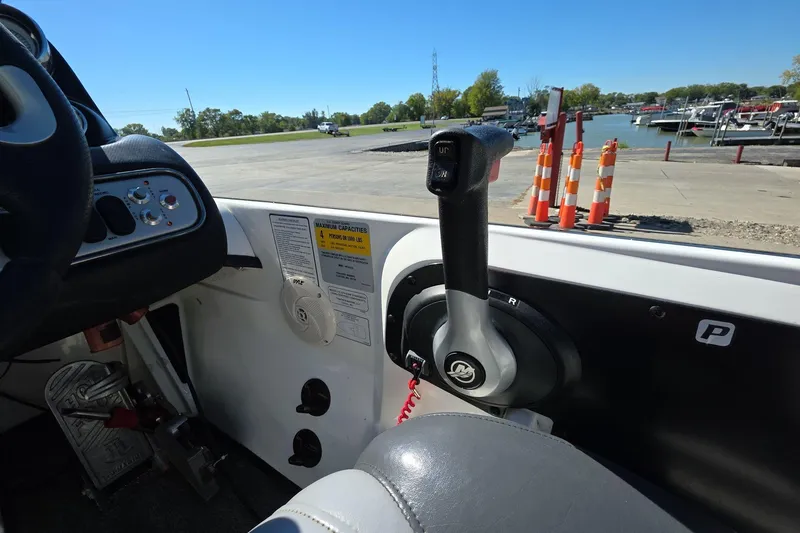 Slide: The Image of Interior of 2011 Nitro Z-8 boat showing control panel and throttle lever. - 15