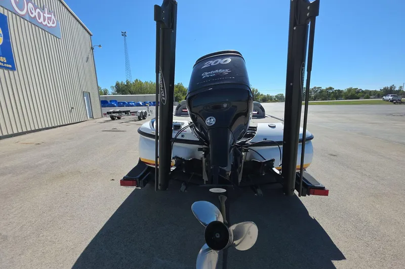 Slide: The Image of Rear view of a 2011 Nitro Z-8 boat with a powerful outboard motor. - 5