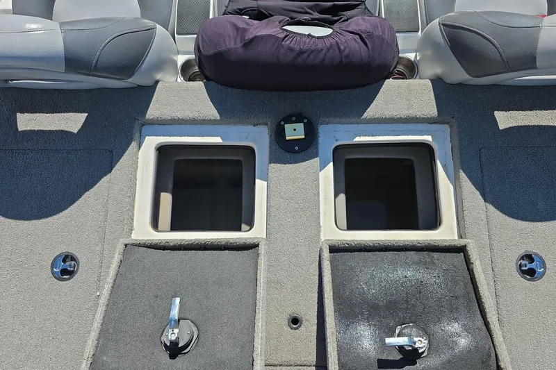 Slide: The Image of 2011 Nitro Z-8 boat interior with storage compartments and seating. - 8
