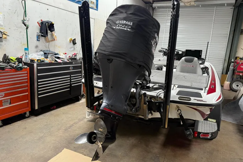 Slide: The Image of 2017 Phoenix 920 ProXP boat in garage with Yamaha motor cover. - 6