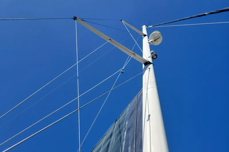 Slide: The Image of Mast and rigging of 2001 Hunter Passage 420 sailboat against clear blue sky. - 11