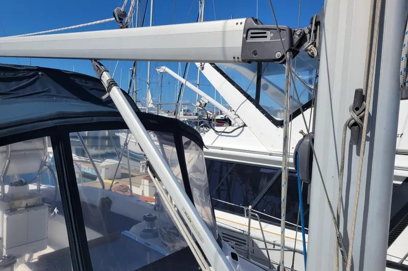 Slide: The Image of 2001 Hunter Passage 420 sailboat with rigging and cockpit details in marina. - 12