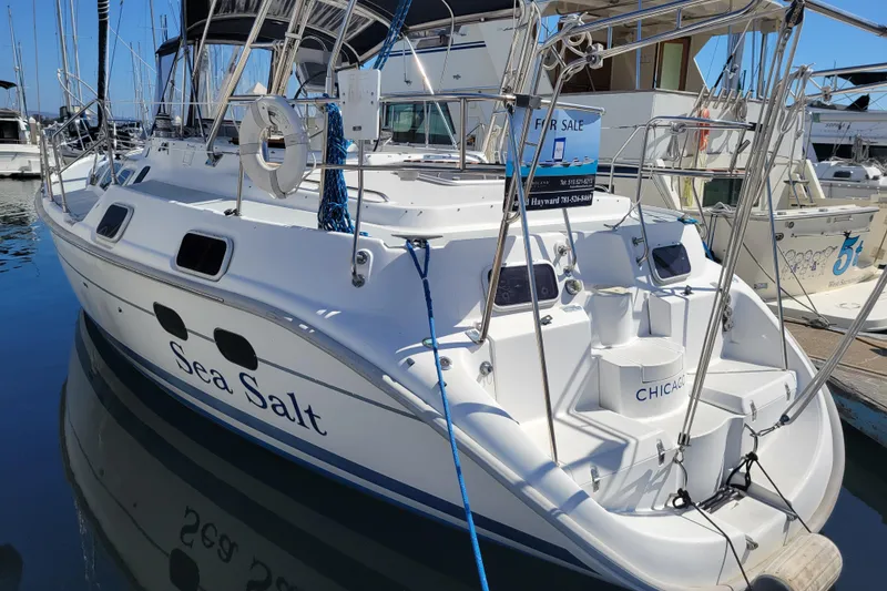 Slide: The Image of 2001 Hunter Passage 420 sailboat "Sea Salt" docked, for sale sign visible. - 13