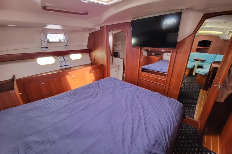 Slide: The Image of Interior of 2001 Hunter Passage 420 yacht with cozy bedroom and modern amenities. - 26