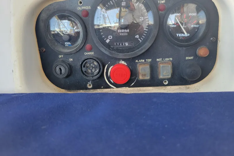 Slide: The Image of Control panel of a 2001 Hunter Passage 420 sailboat with gauges and buttons. - 34