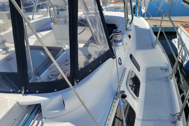 Slide: The Image of 2001 Hunter Passage 420 sailboat deck with winch and cockpit enclosure. - 6