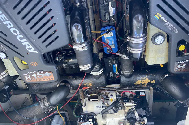 Slide: The Image of Engine compartment of a 2002 Silverton 330 Sport Bridge with MerCruiser 8.1S Horizon engines. - 16
