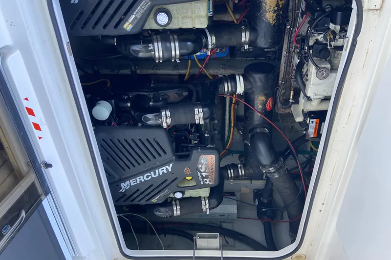 Slide: The Image of Engine compartment of a 2002 Silverton 330 Sport Bridge with Mercury components. - 17