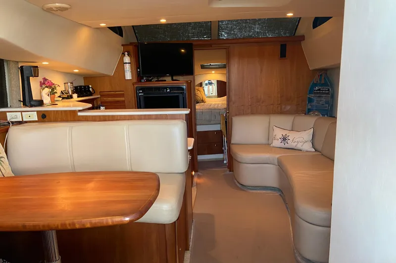 Slide: The Image of Interior of 2002 Silverton 330 Sport Bridge yacht with cozy seating and modern amenities. - 18