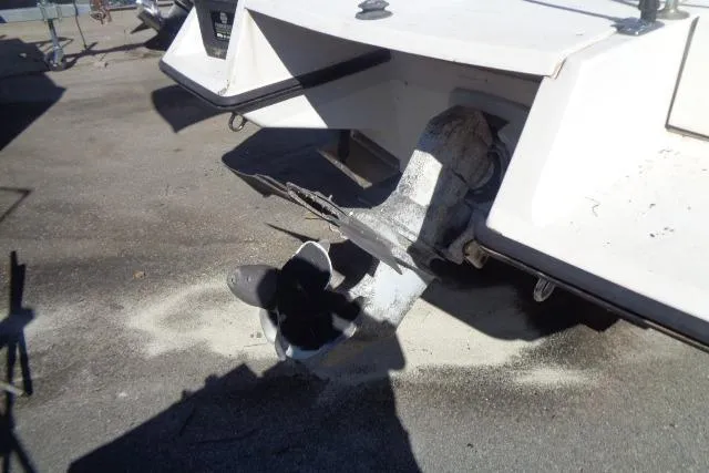 Slide: The Image of 1990 Wellcraft 24 Coastal Walkaround boat stern with visible propeller and outdrive. - 8