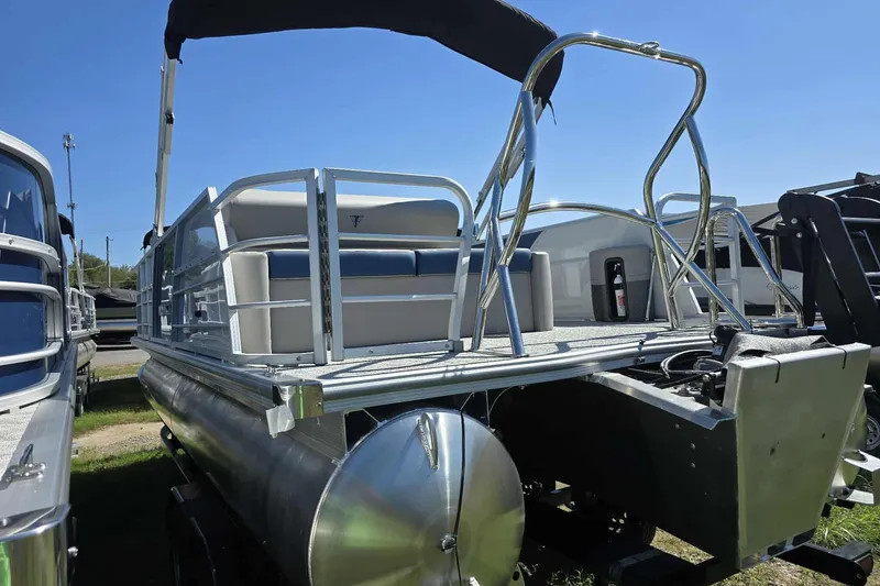 Slide: The Image of 2026 Trifecta 25LE pontoon boat with sleek design and spacious seating. - 10