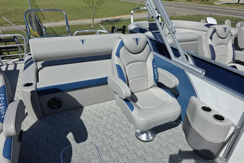 Slide: The Image of 2026 Trifecta 25LE boat interior with plush seating and modern design. - 6
