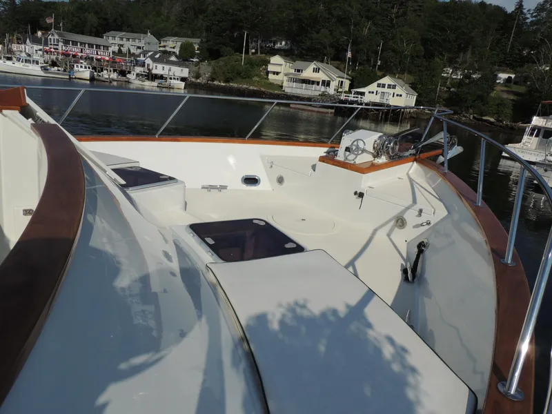 Slide: The Image of 1999 Lyman-Morse pilothouse yacht deck with scenic harbor view. - 13
