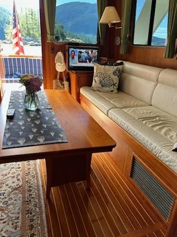 Slide: The Image of Luxurious 1999 Lyman-Morse pilothouse interior with elegant wood finish and comfortable seating. - 27