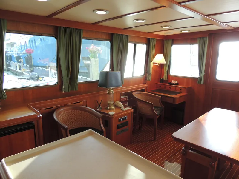 Slide: The Image of Luxurious 1999 Lyman-Morse pilothouse interior with wood paneling and elegant furnishings. - 37