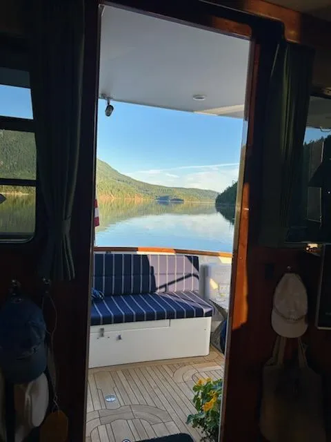 Slide: The Image of View from 1999 Lyman-Morse pilothouse, overlooking serene lake and forested hills. - 40