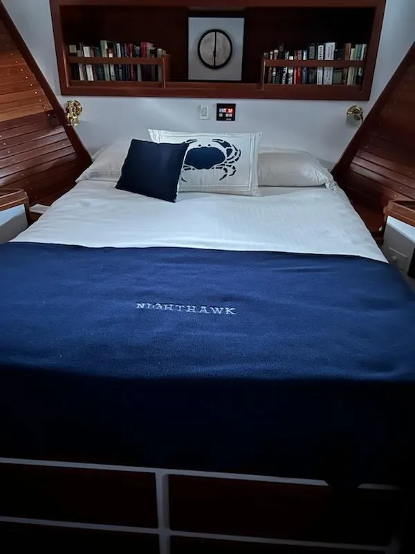 Slide: The Image of Cozy bedroom in 1999 Lyman-Morse pilothouse with nautical decor and bookshelf. - 54